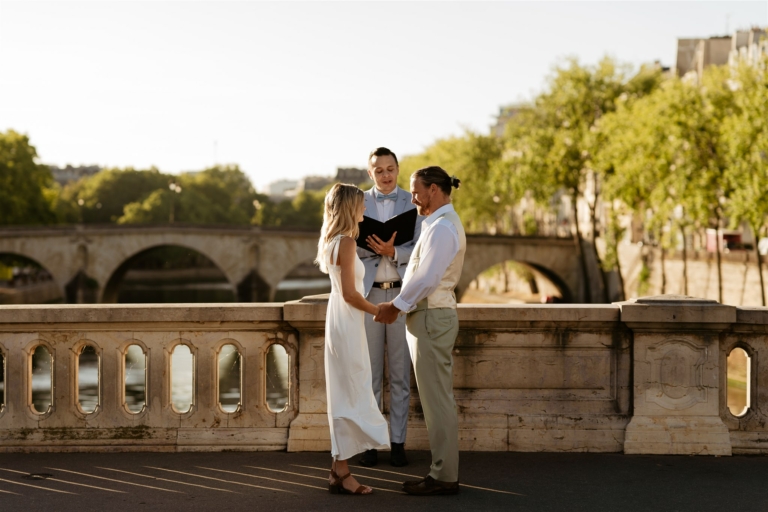 elopement wedding ceremony taking place near the seine in Paris, officiated by the Paris Officiant, a Parisian Wedding Celebrant