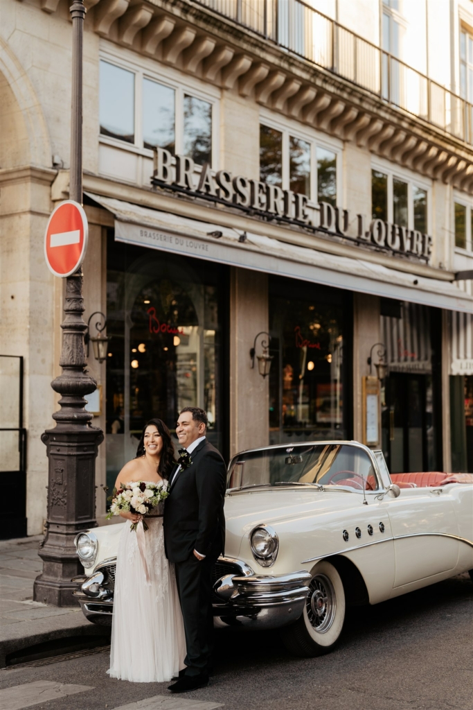 destination paris wedding couple in front of their vintage car after their paris officiant crafted a perfect bespoke ceremony