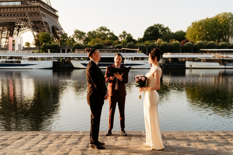 a couple having an elopement wedding ceremony in Paris, with their Paris Officiant near them